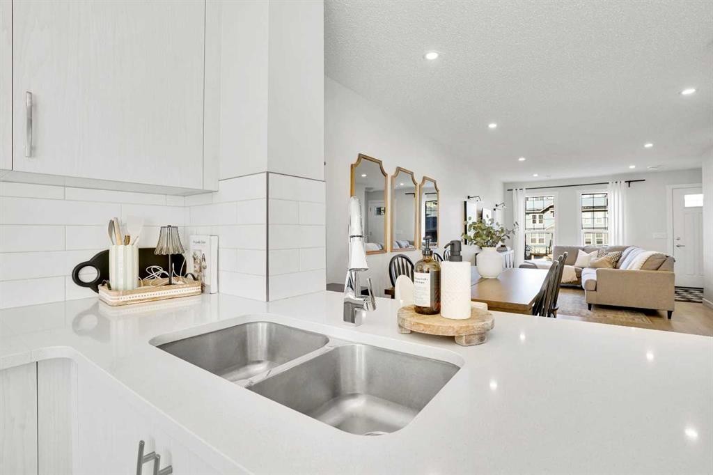 128 Cranbrook Square Se, Calgary, AB - Indoor Photo Showing Kitchen With Double Sink