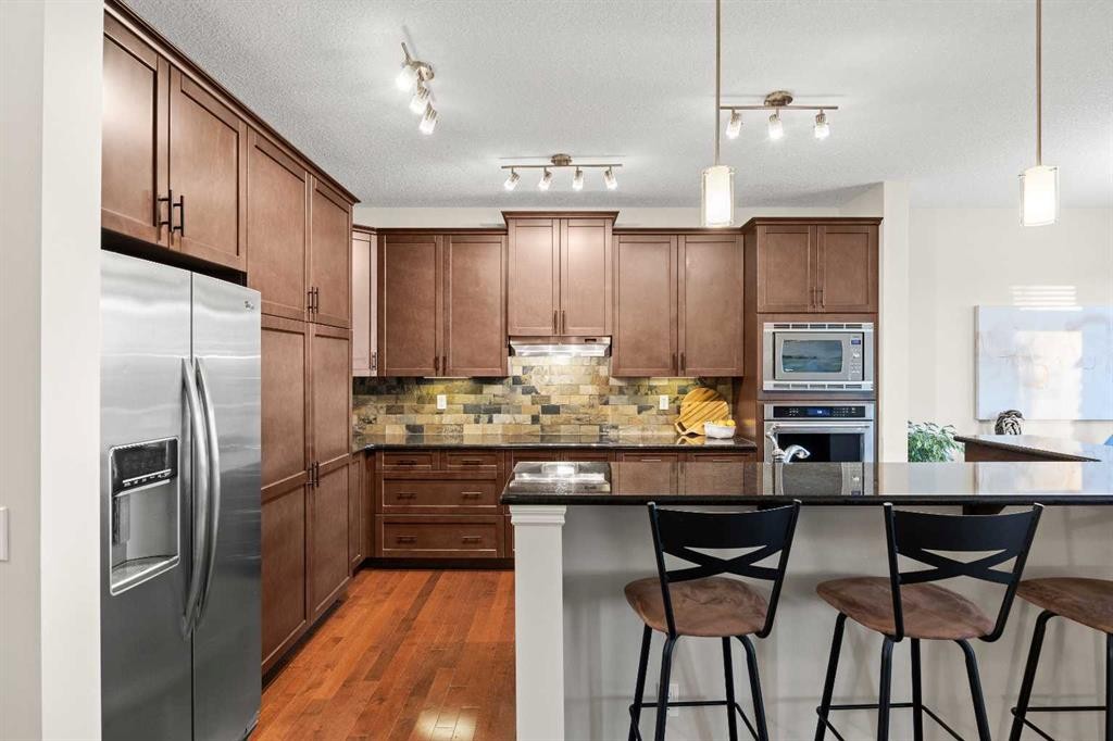 43 Ranchers Crescent, Okotoks, AB - Indoor Photo Showing Kitchen With Stainless Steel Kitchen With Upgraded Kitchen