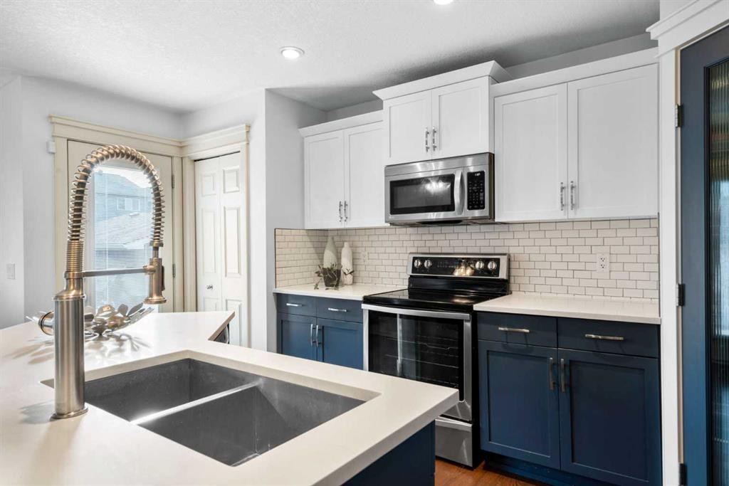 263 Evanston Way Nw, Calgary, AB - Indoor Photo Showing Kitchen With Double Sink