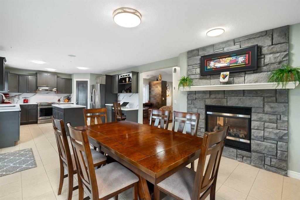 124 Cresthaven Place Sw, Calgary, AB - Indoor Photo Showing Dining Room With Fireplace