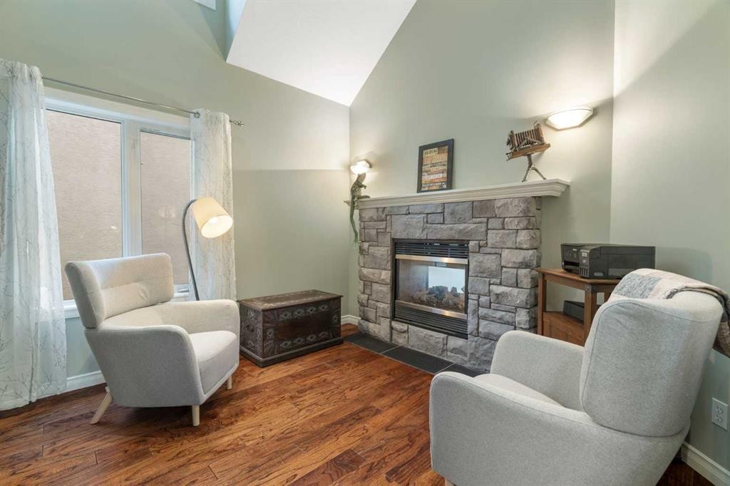 124 Cresthaven Place Sw, Calgary, AB - Indoor Photo Showing Living Room With Fireplace