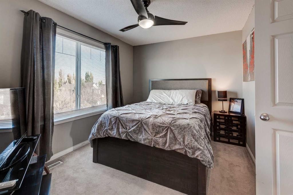 219 Copperfield Lane Se, Calgary, AB - Indoor Photo Showing Bedroom