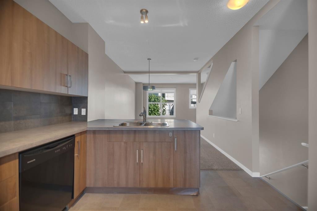 136 New Brighton Point Se, Calgary, AB - Indoor Photo Showing Kitchen With Double Sink