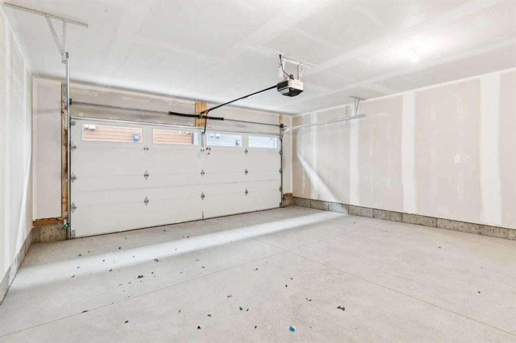 122-1862 Cornerstone Boulevard, Calgary, AB - Indoor Photo Showing Garage