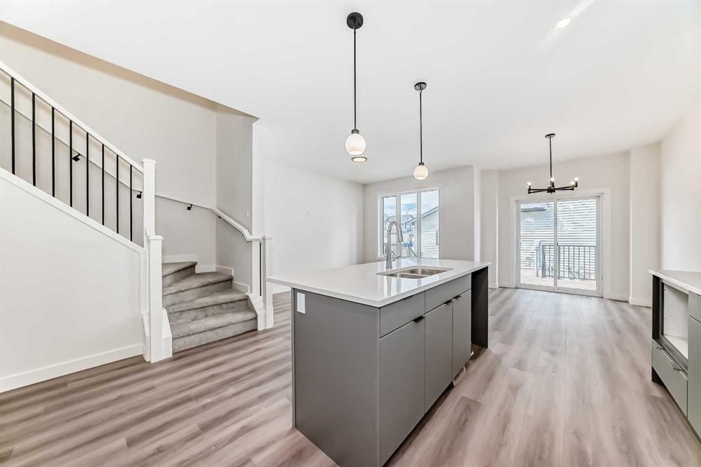 109 Heritage Park, Cochrane, AB - Indoor Photo Showing Kitchen With Double Sink