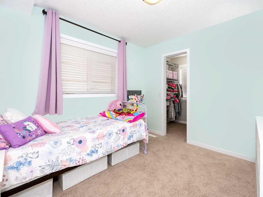 14 Walden Road Se, Calgary, AB - Indoor Photo Showing Bedroom