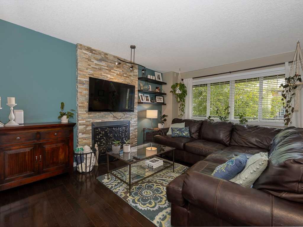 14 Walden Road Se, Calgary, AB - Indoor Photo Showing Living Room With Fireplace