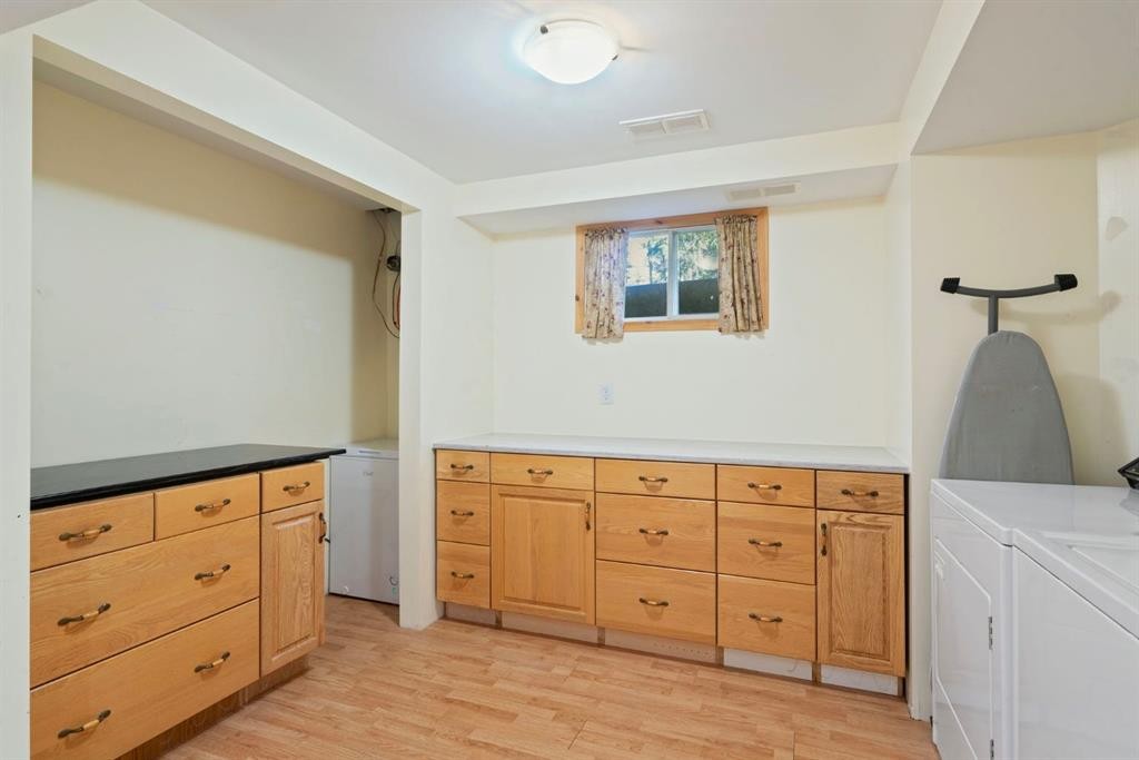 9 Ghost Road, Benchlands, AB - Indoor Photo Showing Laundry Room