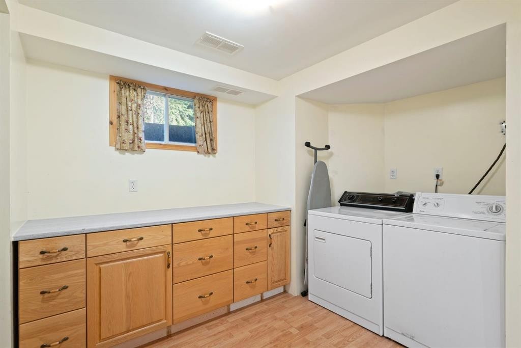 9 Ghost Road, Benchlands, AB - Indoor Photo Showing Laundry Room