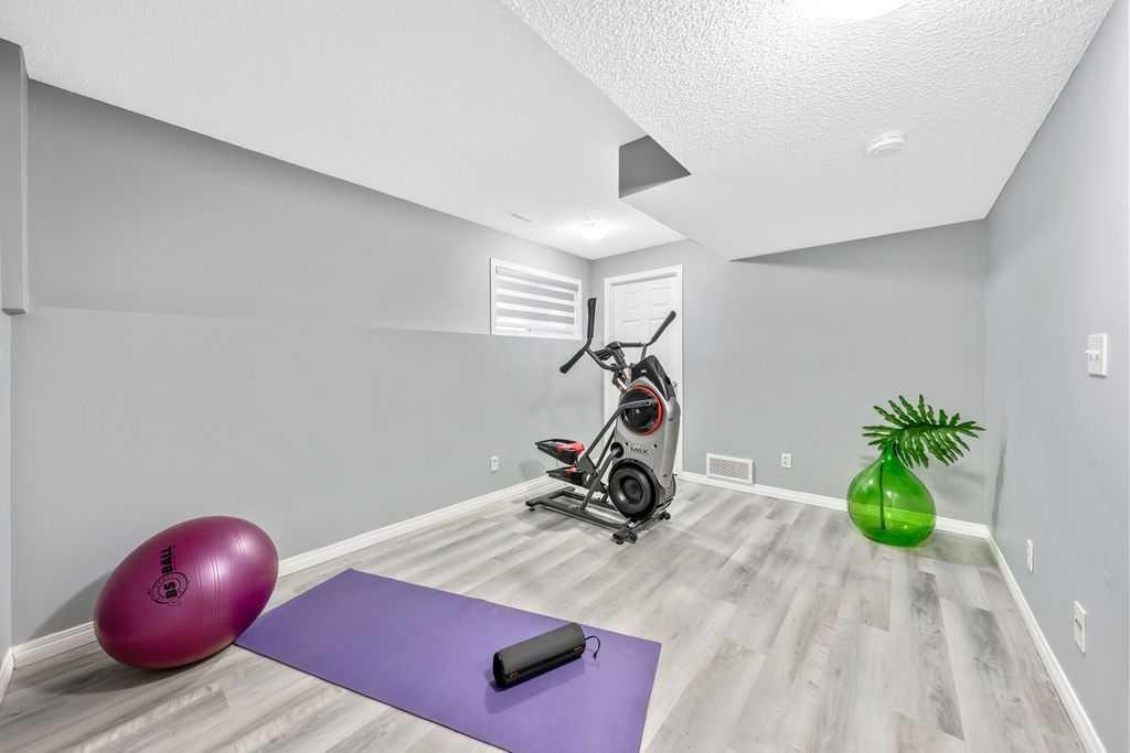 126 Everhollow Heights Sw, Calgary, AB - Indoor Photo Showing Gym Room