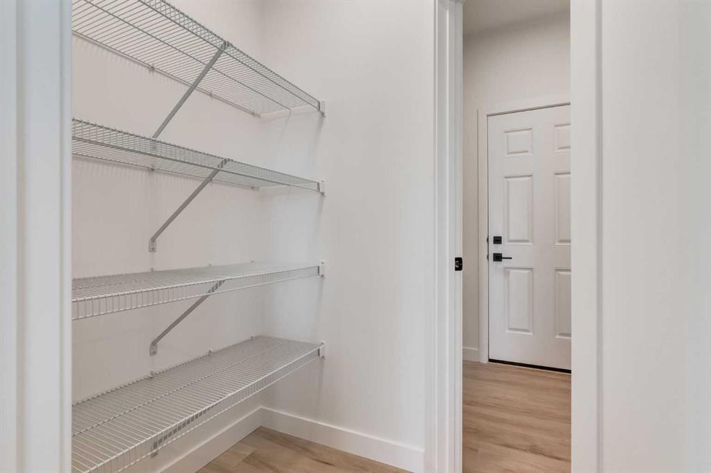 86 Agate Road, Cochrane, AB - Indoor With Storage