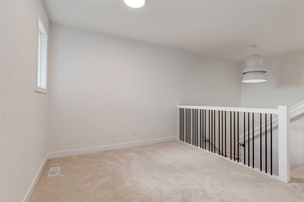 86 Agate Road, Cochrane, AB - Indoor Photo Showing Other Room