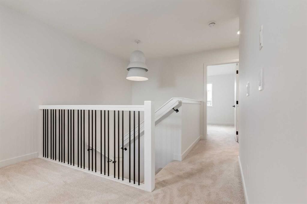 86 Agate Road, Cochrane, AB - Indoor Photo Showing Other Room