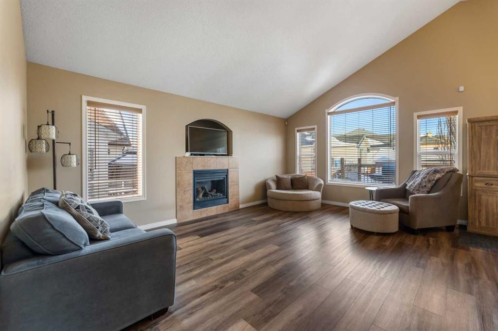 8 Copperfield Manor Se, Calgary, AB - Indoor Photo Showing Living Room With Fireplace