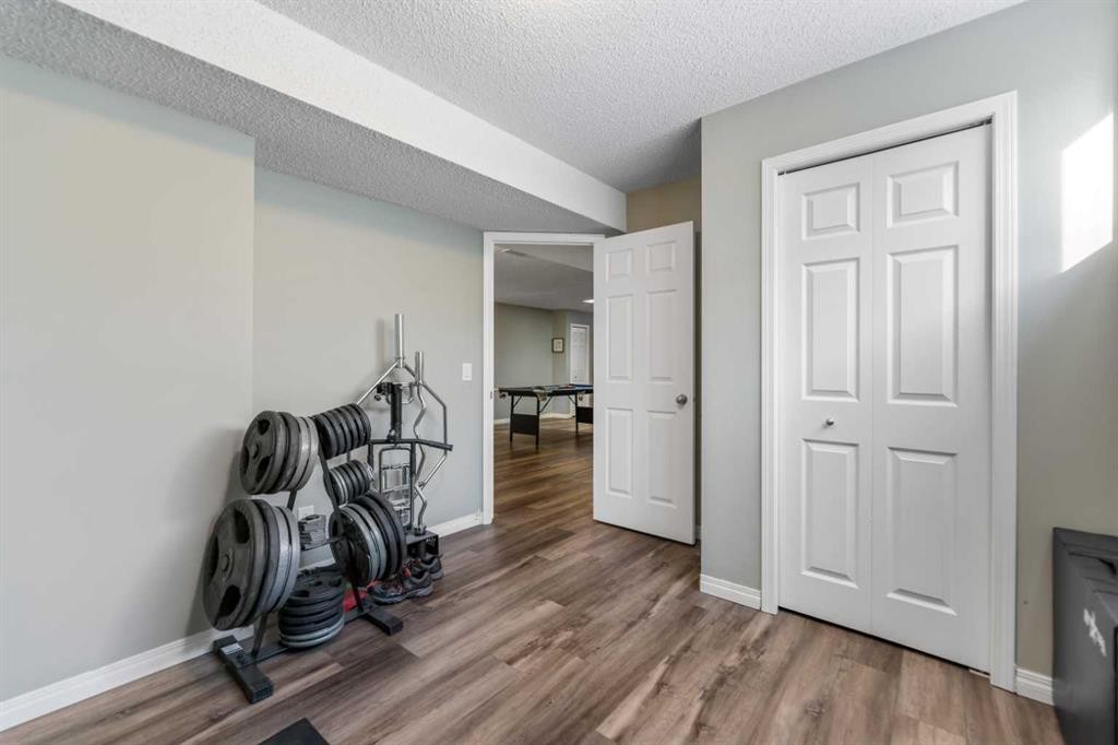 8 Copperfield Manor Se, Calgary, AB - Indoor Photo Showing Other Room