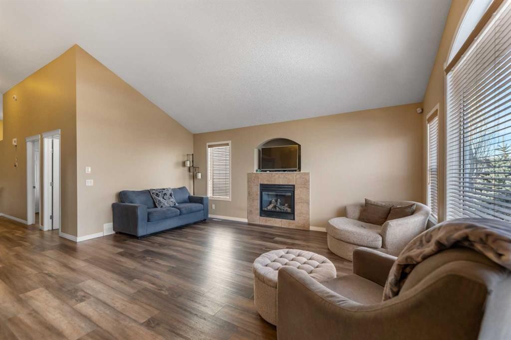 8 Copperfield Manor Se, Calgary, AB - Indoor Photo Showing Living Room With Fireplace