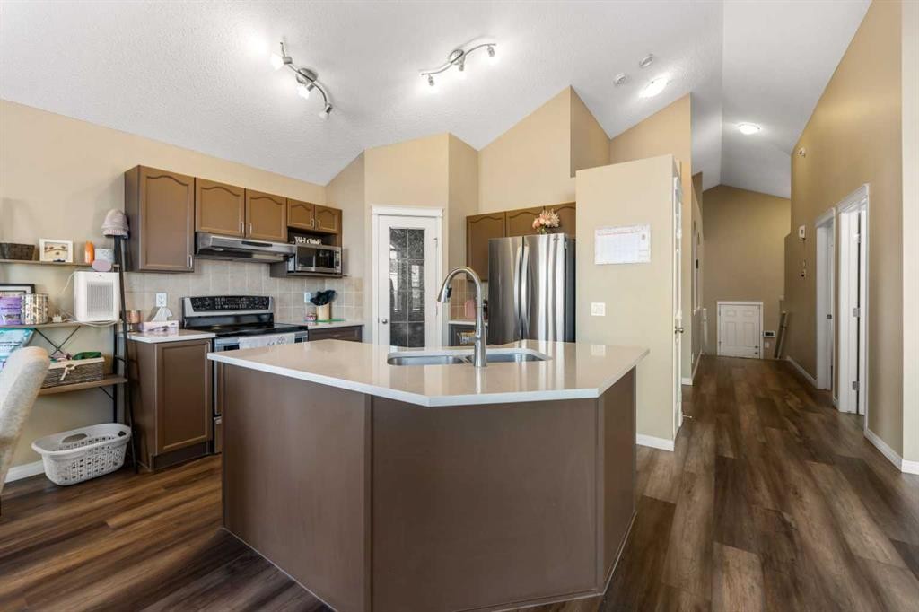 8 Copperfield Manor Se, Calgary, AB - Indoor Photo Showing Kitchen With Stainless Steel Kitchen With Double Sink With Upgraded Kitchen