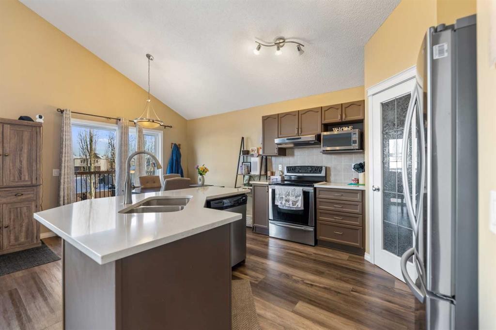 8 Copperfield Manor Se, Calgary, AB - Indoor Photo Showing Kitchen With Stainless Steel Kitchen With Double Sink