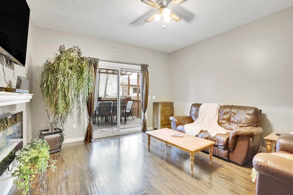 14691 Deer Ridge Drive Se, Calgary, AB - Indoor Photo Showing Living Room With Fireplace