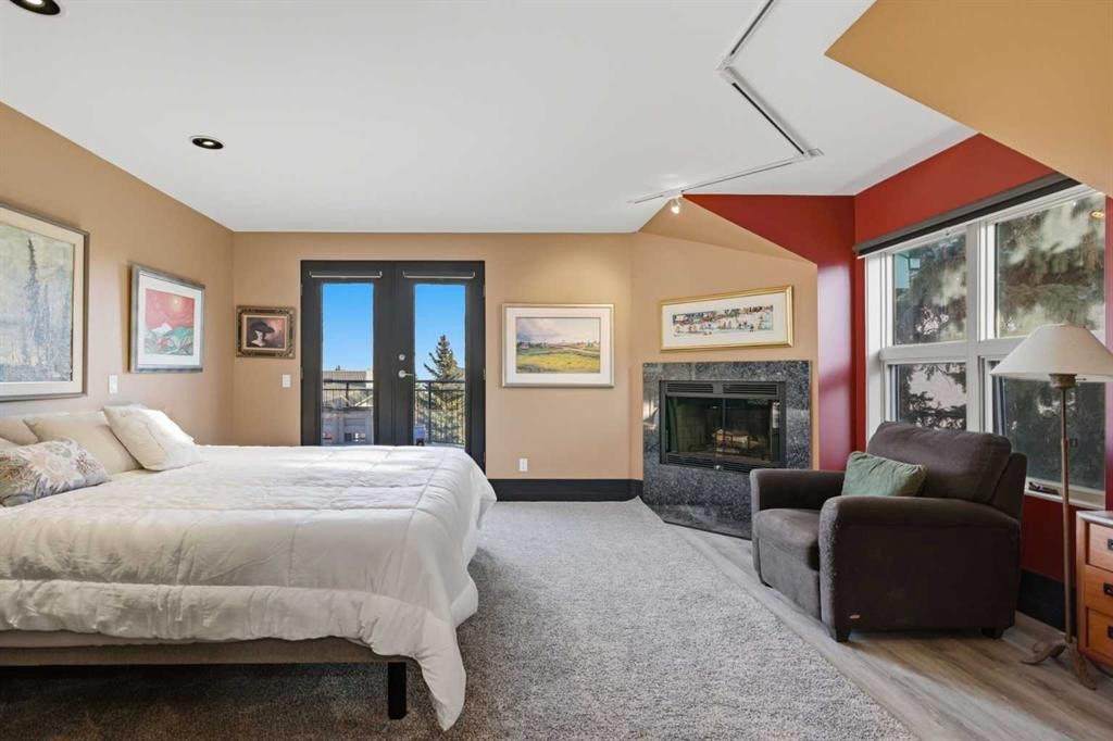 64 Patterson Mews Sw, Calgary, AB - Indoor Photo Showing Bedroom With Fireplace