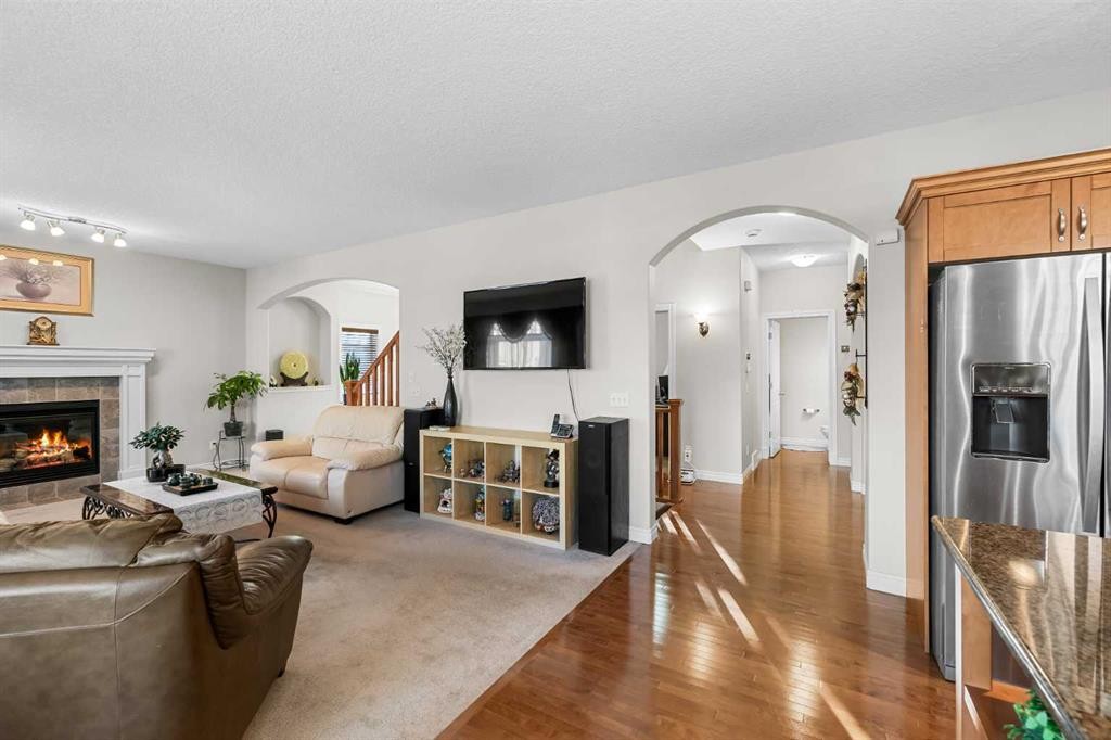 107 Panatella Close Nw, Calgary, AB - Indoor Photo Showing Living Room With Fireplace