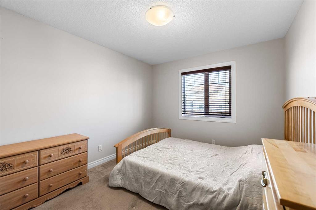 107 Panatella Close Nw, Calgary, AB - Indoor Photo Showing Bedroom