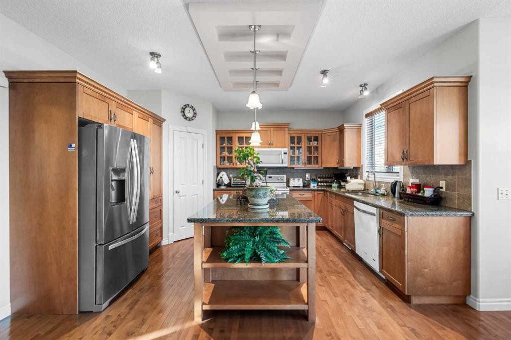 107 Panatella Close Nw, Calgary, AB - Indoor Photo Showing Kitchen With Double Sink