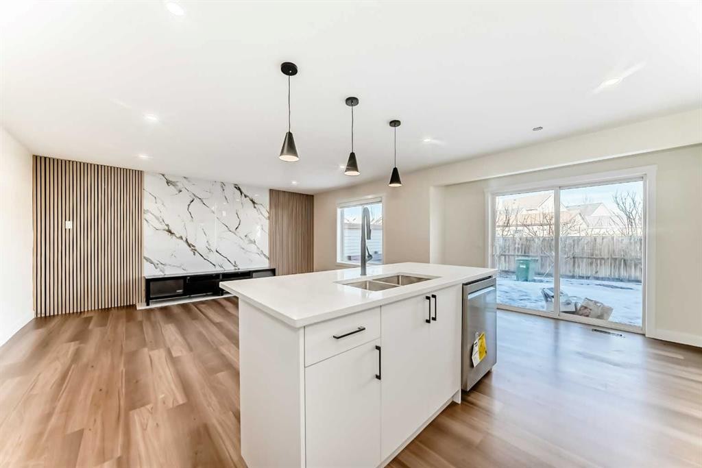 936 Cranston Drive Se, Calgary, AB - Indoor Photo Showing Kitchen With Double Sink