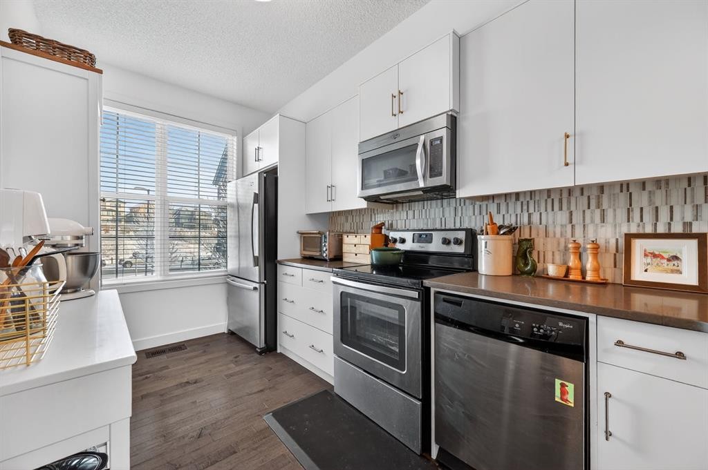 235 Ascot Circle Sw, Calgary, AB - Indoor Photo Showing Kitchen With Stainless Steel Kitchen