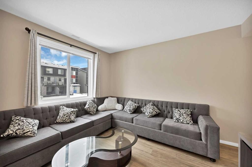203-350 Redstone Ne, Calgary, AB - Indoor Photo Showing Living Room
