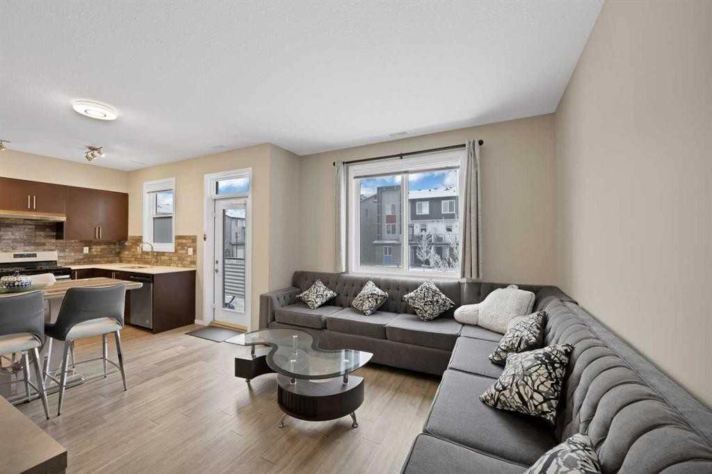 203-350 Redstone Ne, Calgary, AB - Indoor Photo Showing Living Room