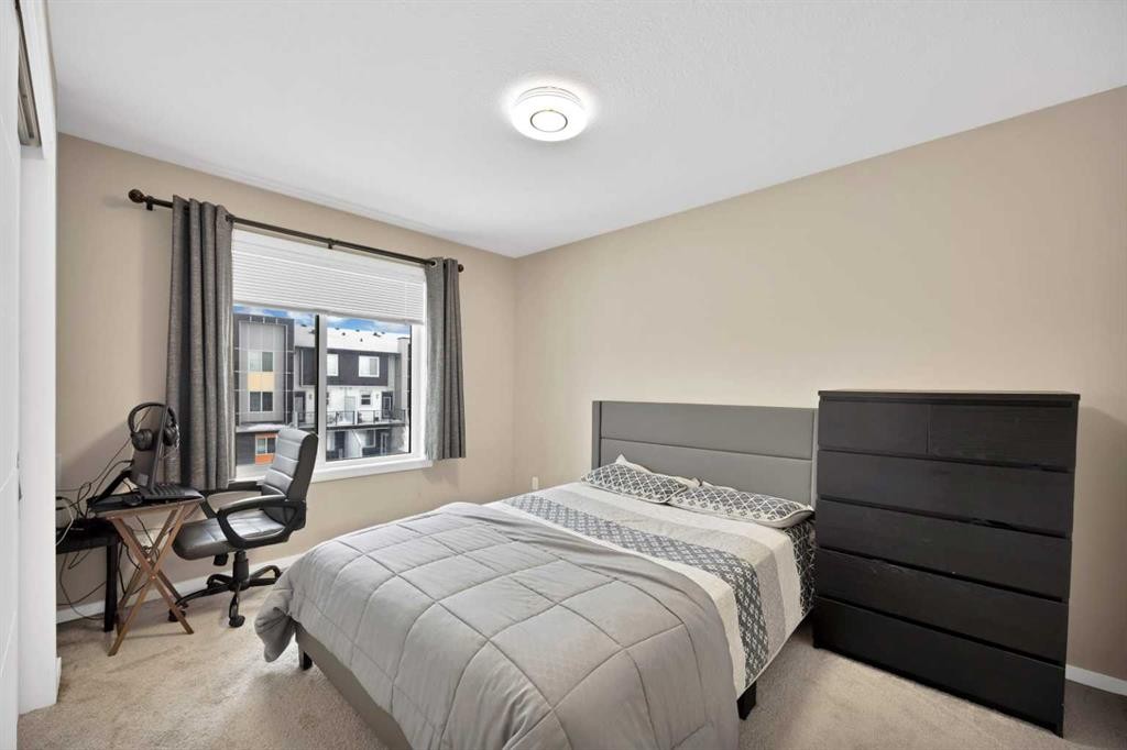 203-350 Redstone Ne, Calgary, AB - Indoor Photo Showing Bedroom