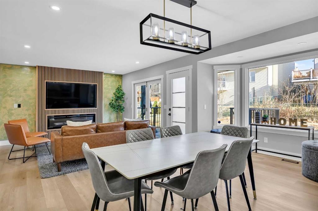 122 Hawkstone Drive Nw, Calgary, AB - Indoor Photo Showing Dining Room With Fireplace