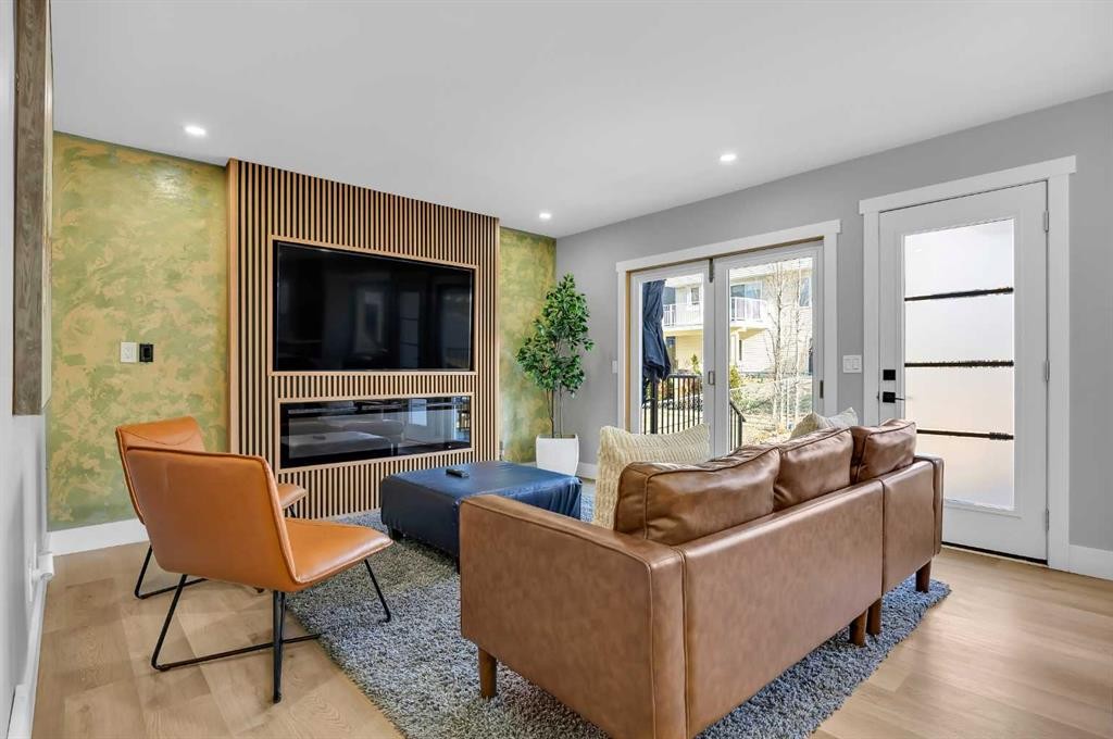 122 Hawkstone Drive Nw, Calgary, AB - Indoor Photo Showing Living Room With Fireplace