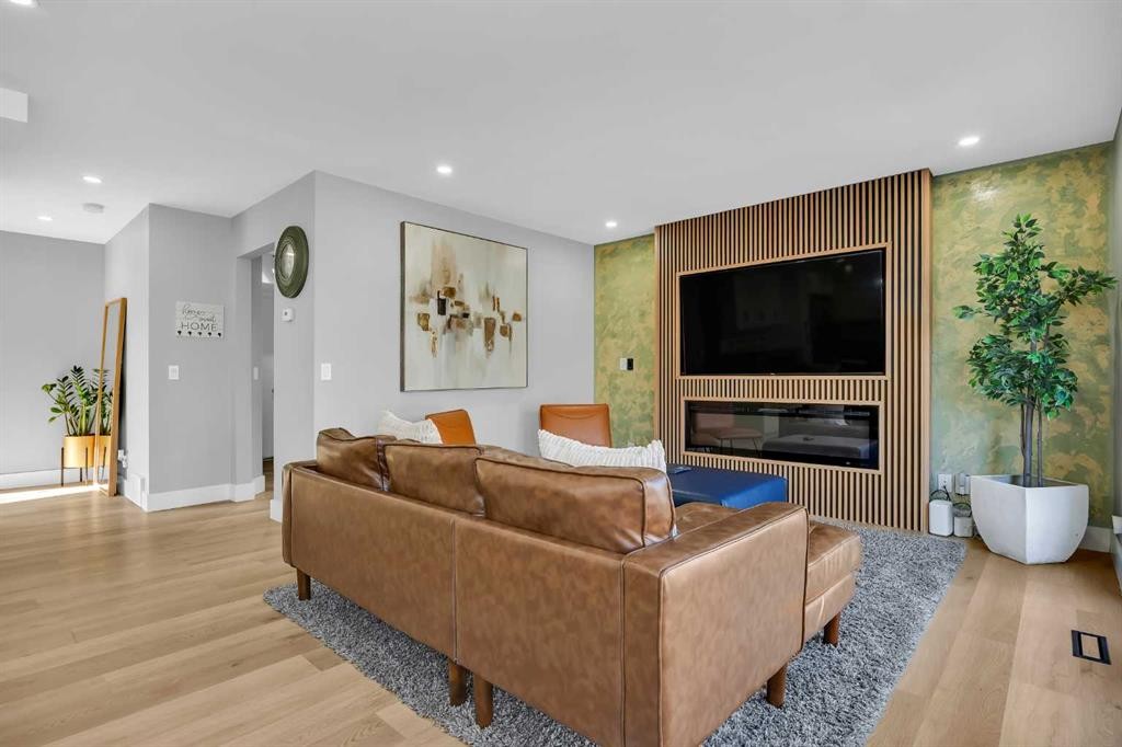 122 Hawkstone Drive Nw, Calgary, AB - Indoor Photo Showing Living Room With Fireplace