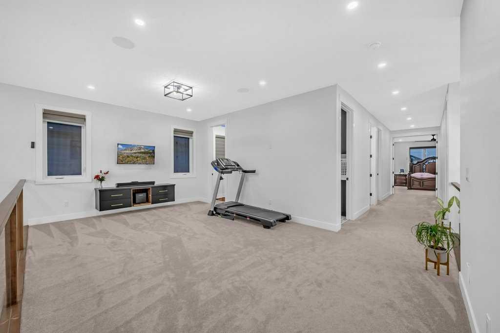 95 Saddlepeace Way Ne, Calgary, AB - Indoor Photo Showing Gym Room