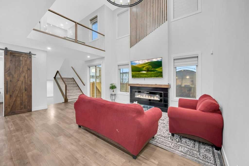 95 Saddlepeace Way Ne, Calgary, AB - Indoor Photo Showing Living Room With Fireplace