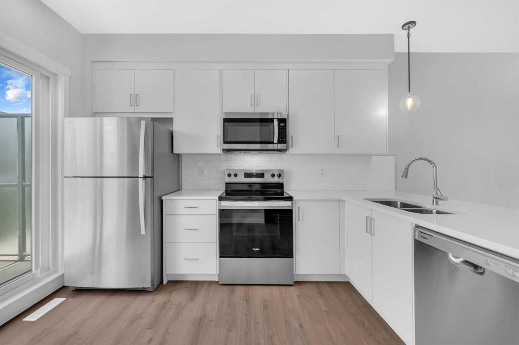 305 Shawnee Square Sw, Calgary, AB - Indoor Photo Showing Kitchen With Stainless Steel Kitchen With Double Sink With Upgraded Kitchen