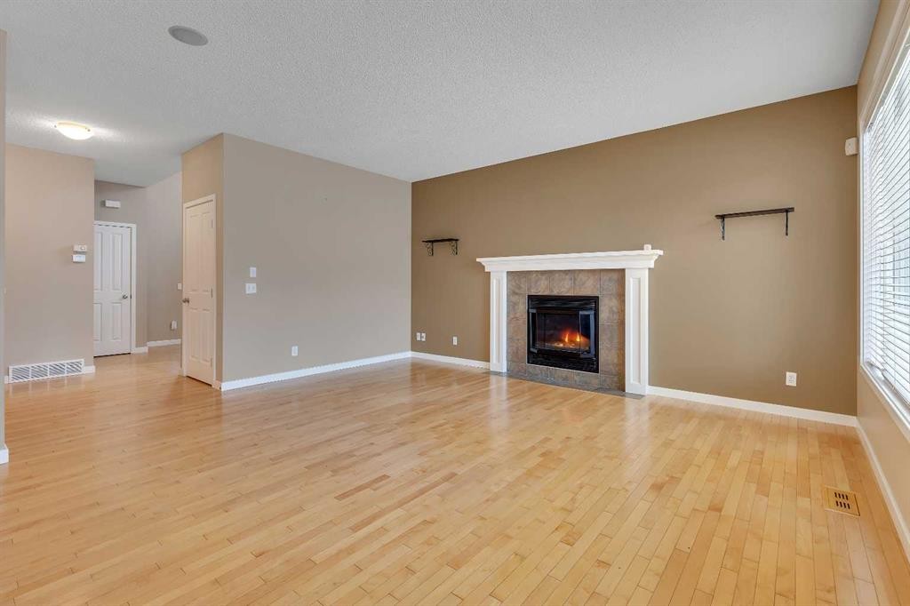 119 Valley Stream Circle Nw, Calgary, AB - Indoor Photo Showing Living Room With Fireplace
