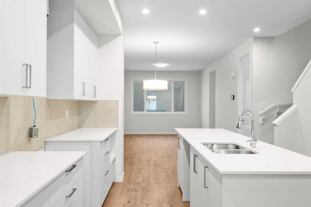 107 Royston Way Nw, Calgary, AB - Indoor Photo Showing Kitchen With Double Sink