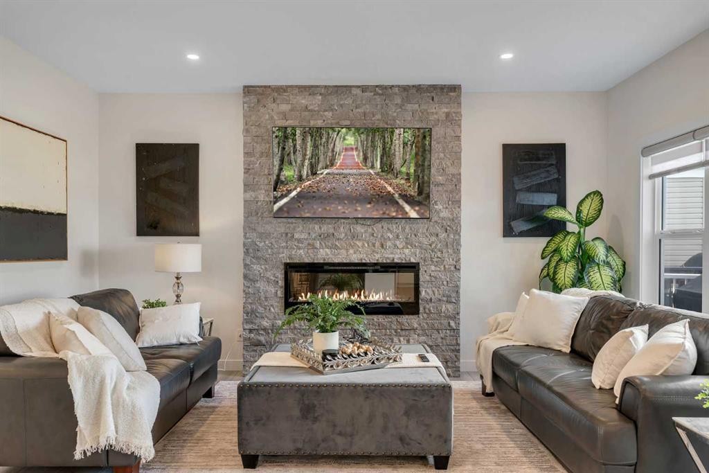 1315 Bayside Drive Sw, Airdrie, AB - Indoor Photo Showing Living Room With Fireplace