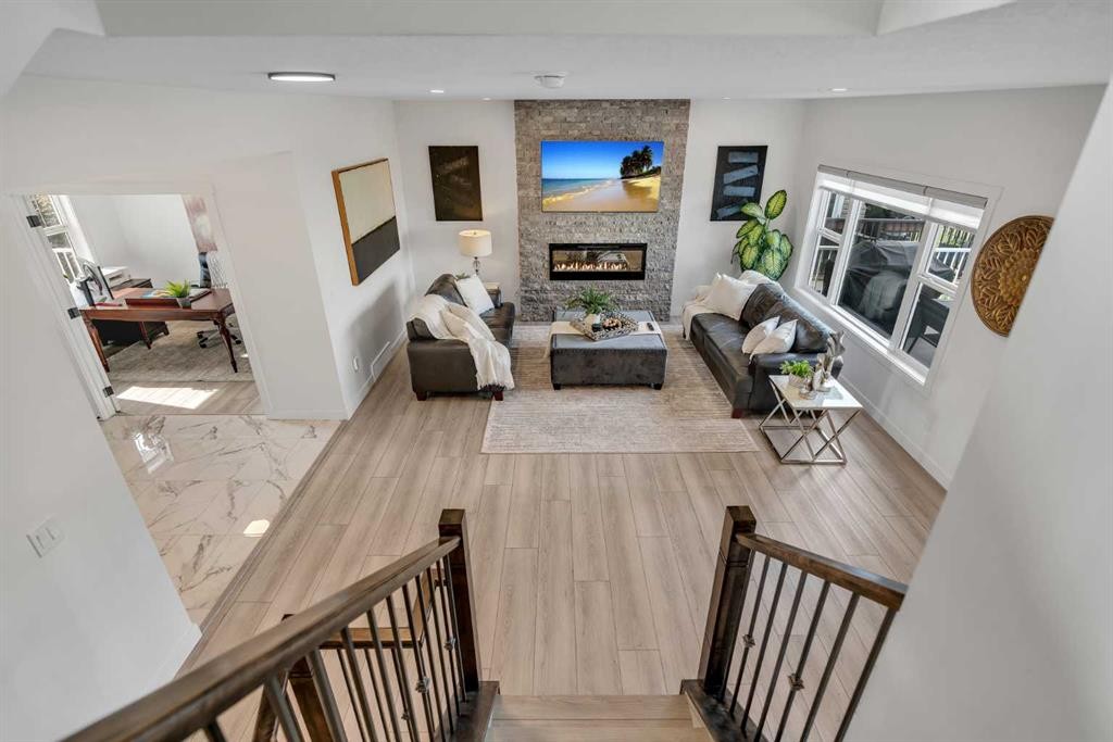 1315 Bayside Drive Sw, Airdrie, AB - Indoor With Fireplace