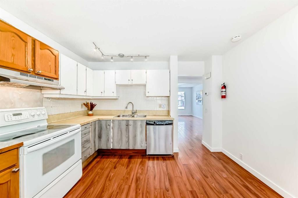 51A Fonda Green Se, Calgary, AB - Indoor Photo Showing Kitchen With Double Sink