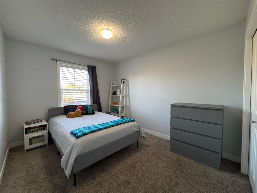 1091 Brightoncrest Green Se, Calgary, AB - Indoor Photo Showing Bedroom