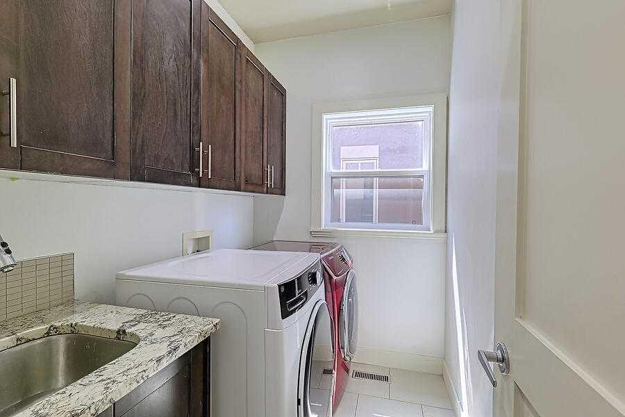 16 Rockcliff Point Nw, Calgary, AB - Indoor Photo Showing Laundry Room