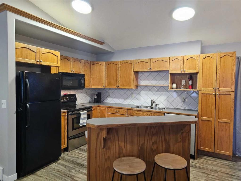 1808 Strathcona Bay, Strathmore, AB - Indoor Photo Showing Kitchen With Double Sink