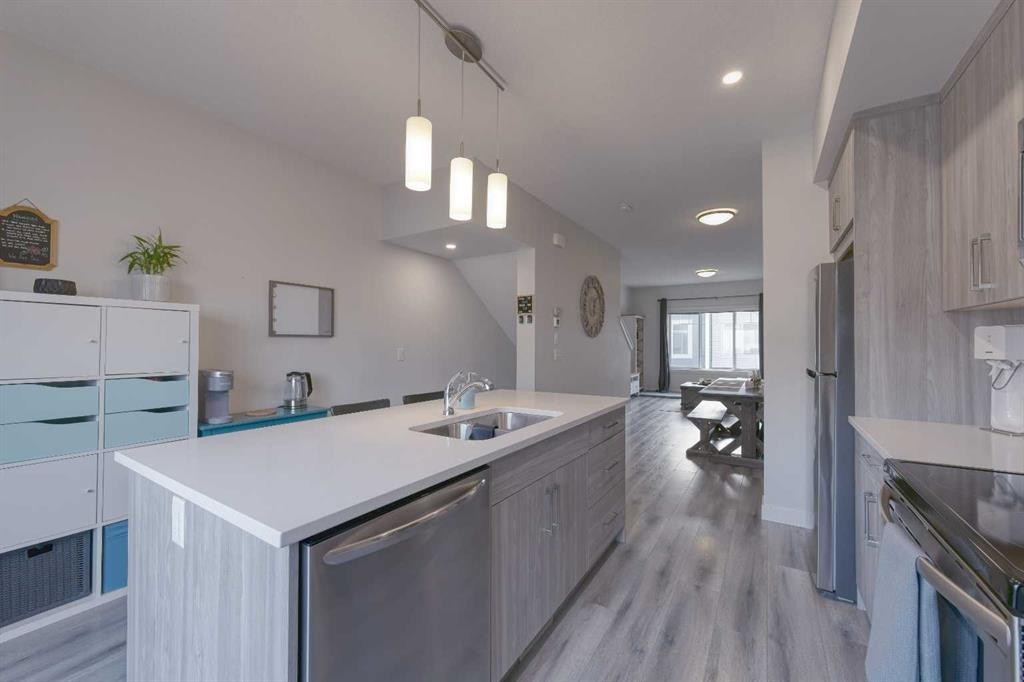 518 Canals Crossing, Airdrie, AB - Indoor Photo Showing Kitchen With Double Sink