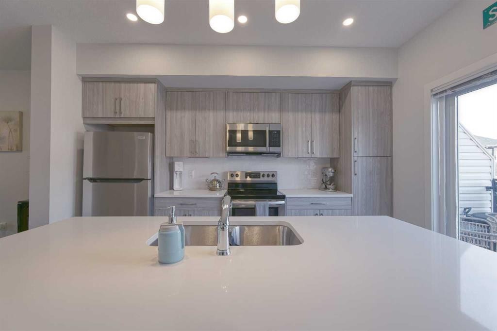 518 Canals Crossing, Airdrie, AB - Indoor Photo Showing Kitchen With Stainless Steel Kitchen With Upgraded Kitchen