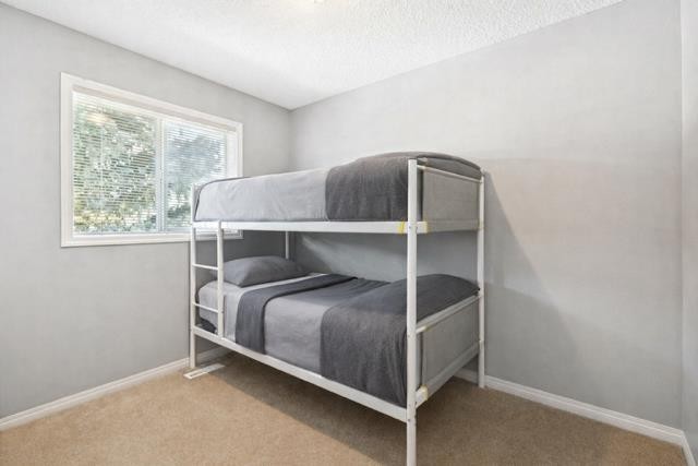 22 Country Hills Cove Nw, Calgary, AB - Indoor Photo Showing Bedroom