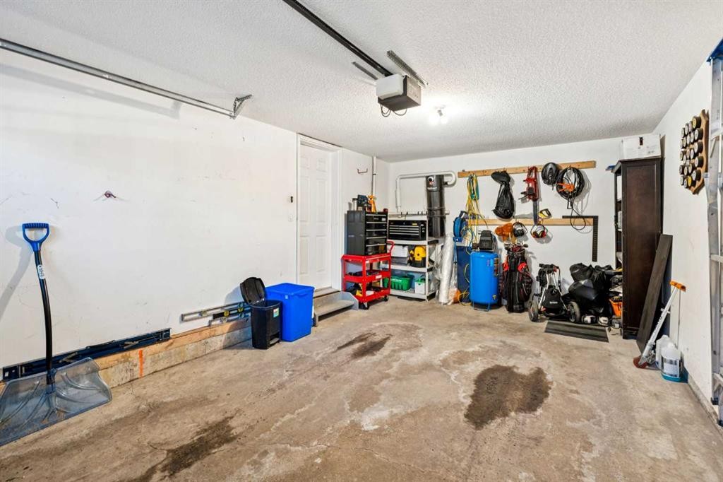 22 Country Hills Cove Nw, Calgary, AB - Indoor Photo Showing Garage